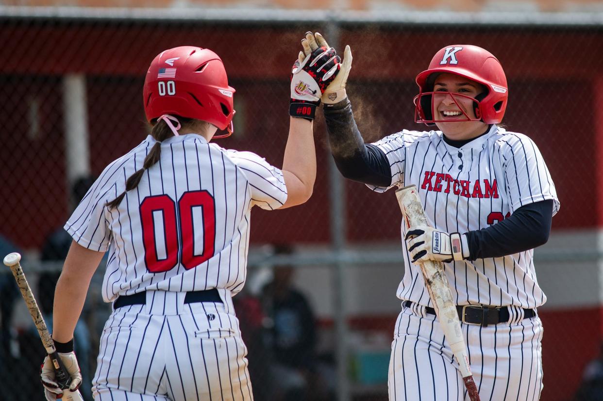 Ketcham's Kaelyn Brenner high-fives teammate Christiana Simou after scoring a run against Columbia during the Bisaccia Softball Tournament in Wappingers Falls, NY on Saturday, April 27, 2024.