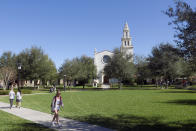 In this Tuesday, Jan. 28, 2020 photo, students are seen on campus at Rollins College in Winter Park, Fla. Because of the federal privacy law, university administrators, if called upon, won't be able to disclose students' sex, race or Hispanic origin on the 2020 Census form.(AP Photo/John Raoux)