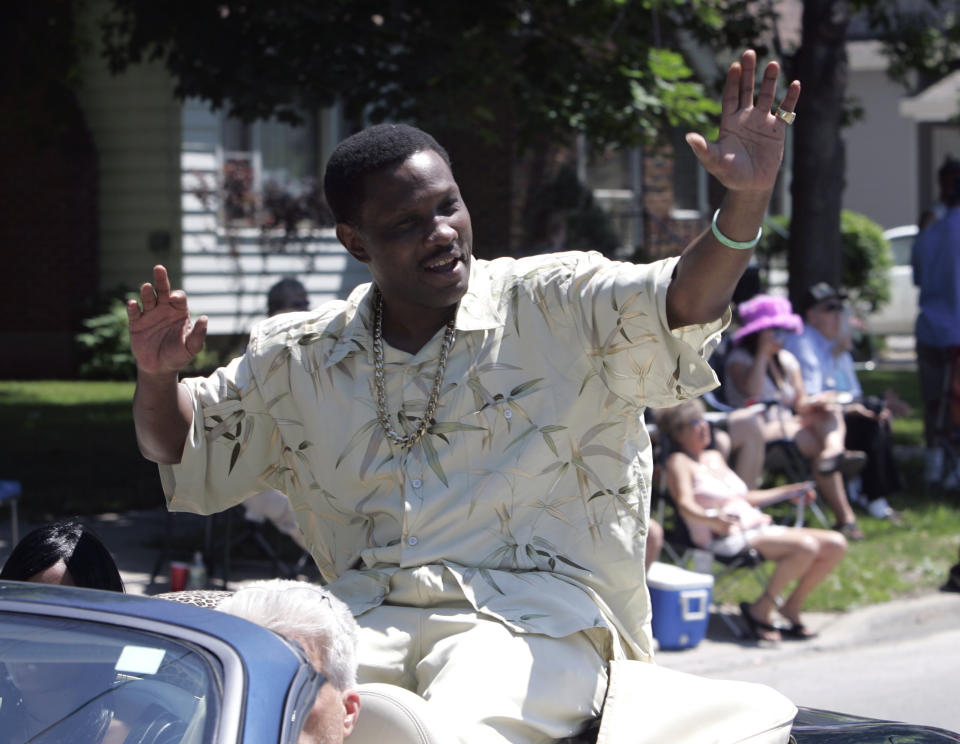 FILE - In this June 10, 2007, file photo, Pernell Whitaker waves to the crowd during a parade before he was inducted into the International Boxing Hall of Fame in Canastota, N.Y. Former boxing champion Pernell Whitaker has died after he was hit by a car in Virginia. He was 55. Police in Virginia Beach on Monday say Whitaker was a pedestrian when struck by the car Sunday night, July 14, 2019. The driver remained on the scene, where Whitaker was pronounced dead. (AP Photo/Mike Groll, File)