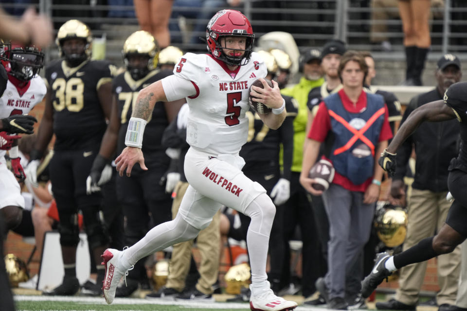 North Carolina State quarterback Brennan Armstrong (5) runs for a long gain against Wake Forest during the first half of an NCAA college football game in Winston-Salem, N.C., Saturday, Nov. 11, 2023. (AP Photo/Chuck Burton)