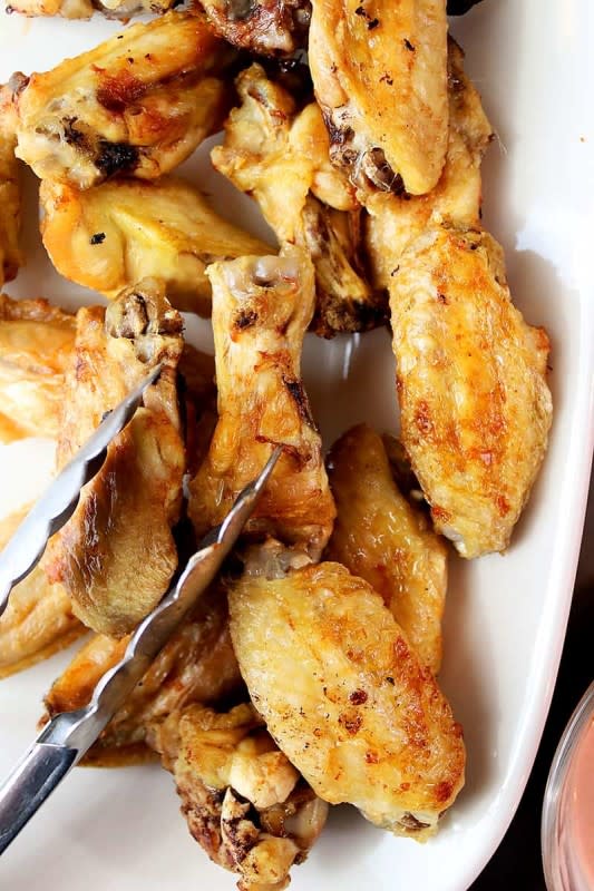 <p>Crispy air fryer naked chicken wings with the option to coat them in hot sauce, teriyaki glaze, sweet chili, honey garlic, or just eat them plain!</p><p><strong>Get the recipe: <a href="https://simplyhappenings.com/air-fryer-naked-chicken-wings/" rel="nofollow noopener" target="_blank" data-ylk="slk:Air Fryer Naked Chicken Wings;elm:context_link;itc:0;sec:content-canvas" class="link rapid-noclick-resp">Air Fryer Naked Chicken Wings</a></strong></p>