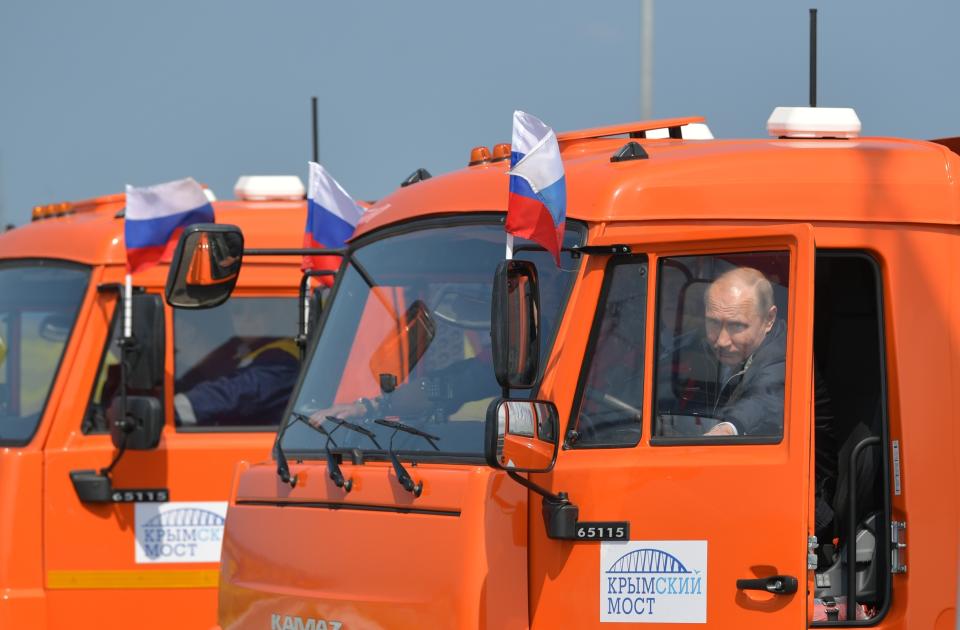 FILE - Russian President Vladimir Putin prepares to drive a truck to officially open the much-anticipated bridge linking Russia and the Crimean peninsula, during the opening ceremony near in Kerch, Crimea, on May 15, 2018. Putin opens the 18-kilometer (12-mile) bridge from Russia to Crimea, solidifying Moscow's annexation. (Alexei Druzhinin, Sputnik, Kremlin Pool Photo via AP, File)