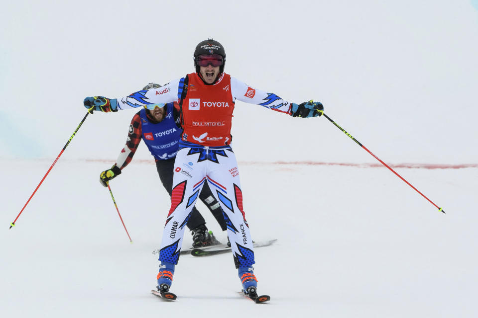 Francois Place, front, of France, celebrates after winning the men's ski cross event at the freestyle ski and snowboard world championships, Saturday, Feb. 2, 2019, in Solitude, Utah. (AP Photo/Alex Goodlett)