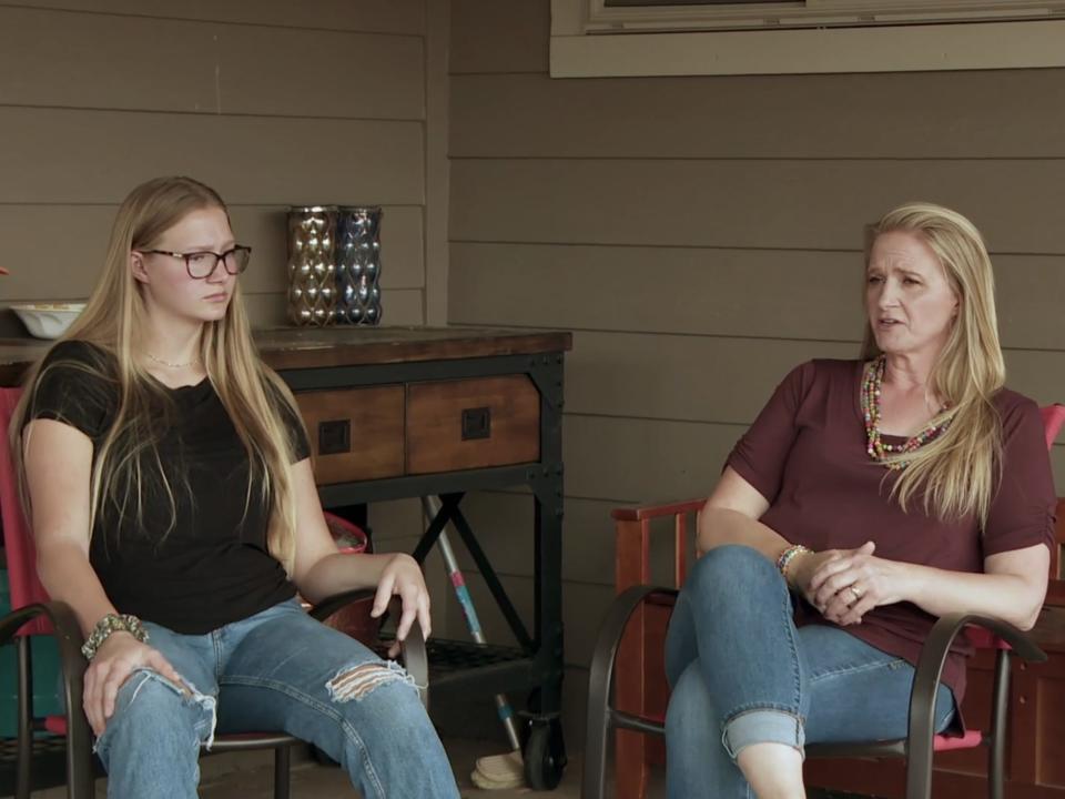 Ysabel and Christine Brown sitting down.