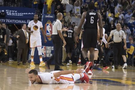 January 28, 2017; Oakland, CA, USA; Golden State Warriors guard Stephen Curry (30) celebrates after making a half court shot against the Los Angeles Clippers during the second quarter at Oracle Arena. Mandatory Credit: Kyle Terada-USA TODAY Sports