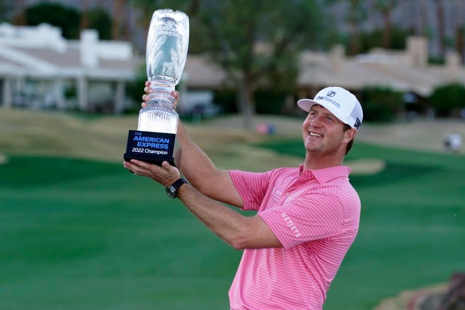 Hudson Swafford lifts the winner’s trophy at the end of the American Express in La Quinta, California (AP Photo/Marcio Jose Sanchez) (AP)