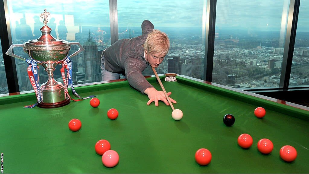 Neil Robertson shooting at a red