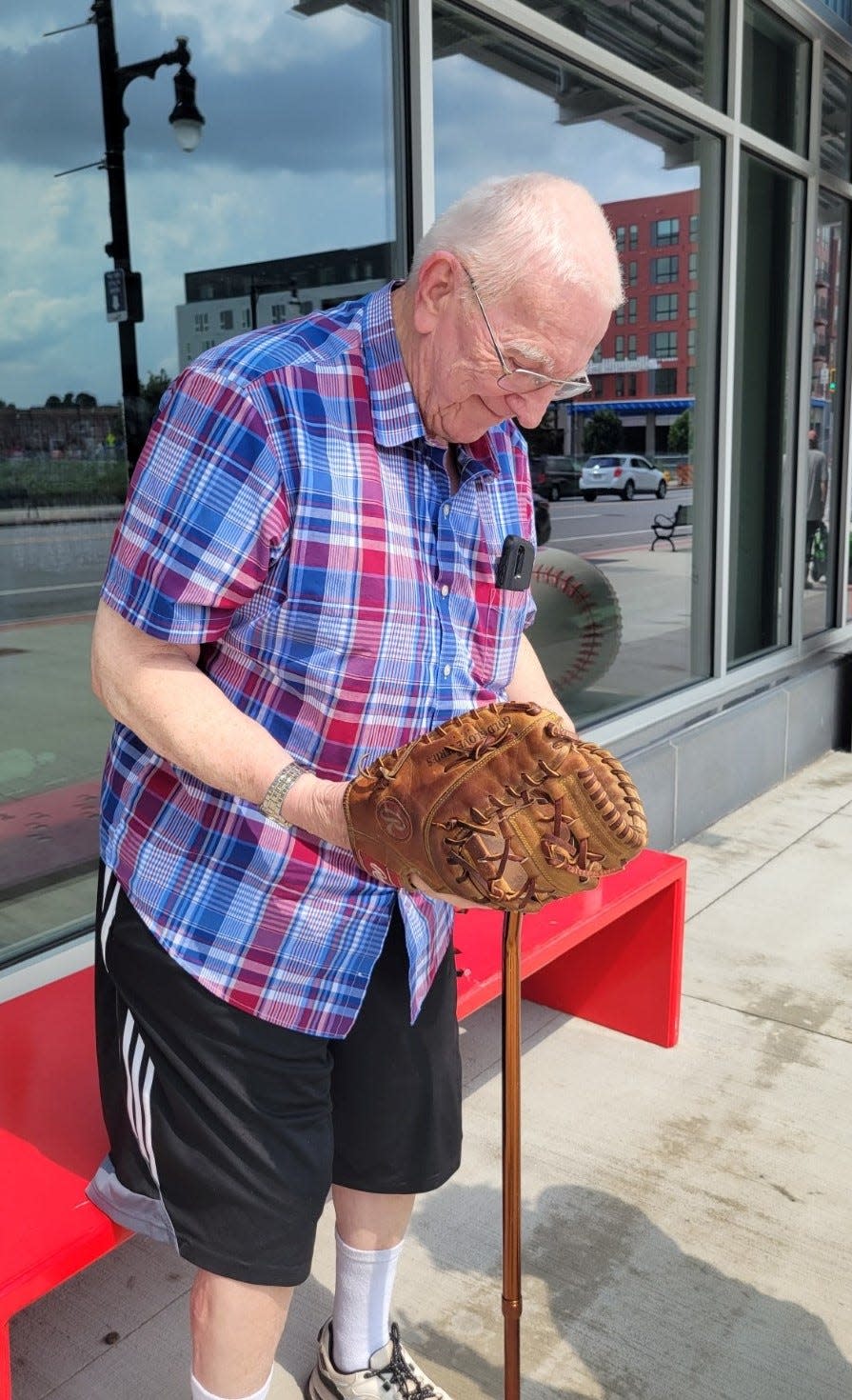 Donald Holcomb was all smiles after he was reunited with his baseball glove outside of Polar Park on July 18.