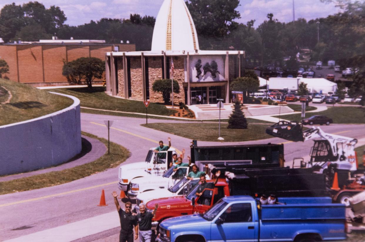 A photograph of the 1998 landscaping crew for the Petitti landscaping outside the Pro Football Hall of Fame that they cared for as depicted in a 75th anniversary flyer.
