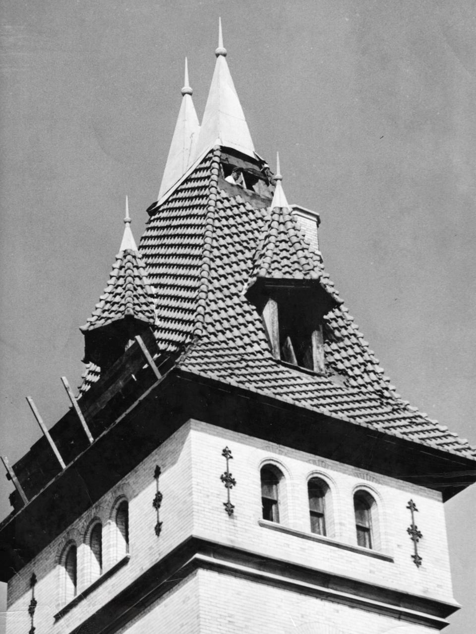 The Munson-Williams Memorial building was razed in 1959, but many still remember the touch of grandeur it gave downtown Utica. It stood on a triangular plot boarded by John and Elizabeth streets and Park Avenue. Its ornate red-tiled roof is shown here.