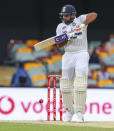 India's Rohit Sharma bats during play on day four of the fourth cricket test between India and Australia at the Gabba, Brisbane, Australia, Monday, Jan. 18, 2021. (AP Photo/Tertius Pickard)