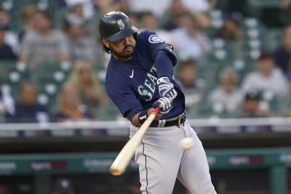 Seattle Mariners' Eugenio Suarez hits a two-run home run against the Detroit Tigers in the first inning of a baseball game in Detroit, Wednesday, Aug. 31, 2022. (AP Photo/Paul Sancya)