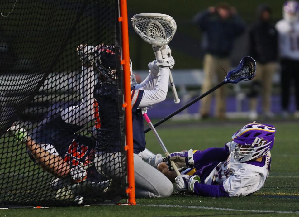 John Jay's Dom Savastano (15) scores a goal against Briarcliff during boys lacrosse action at John Jay High School in Cross River March 28, 2024. John Jay won the game 15-3.