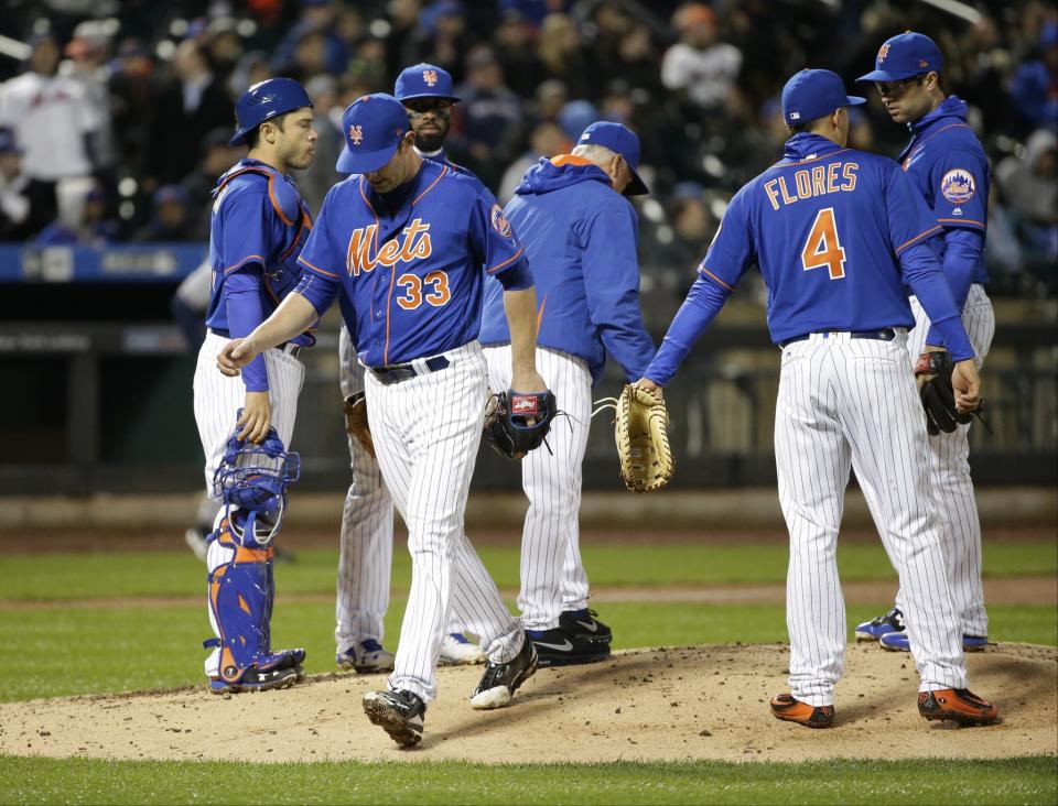 Harvey left in the seventh inning to a standing ovation. (AP)