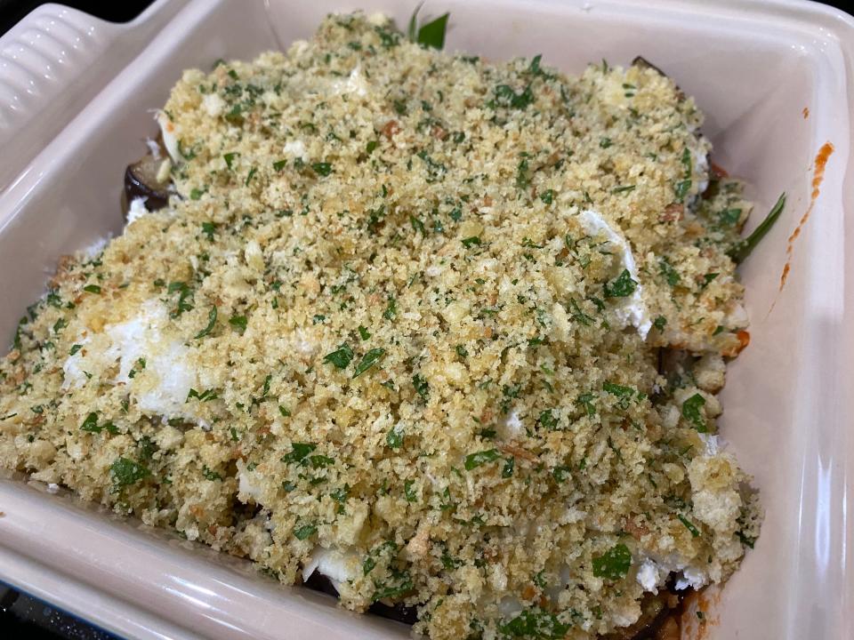 Eggplant Parmesan in a baking dish topped with breadcrumbs.