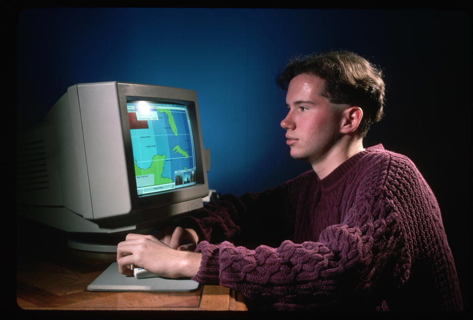 kid playing on computer