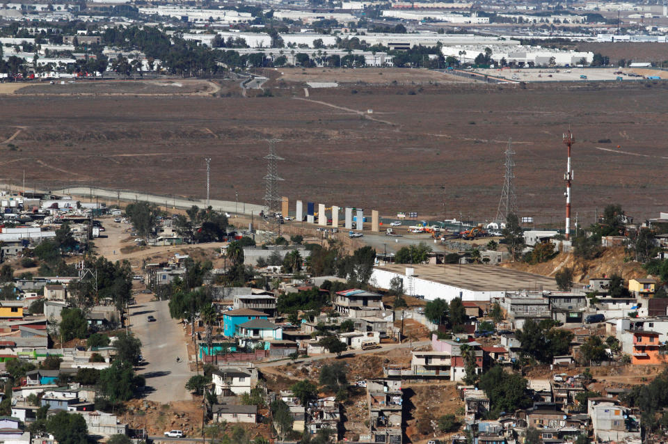 <p>Prototypes (C) for President Donald Trump’s border wall with Mexico are shown near completion in this picture taken from the Mexican side of the border, in Tijuana, Mexico, Oct. 23, 2017. (Photo: Jorge Duenes/Reuters) </p>