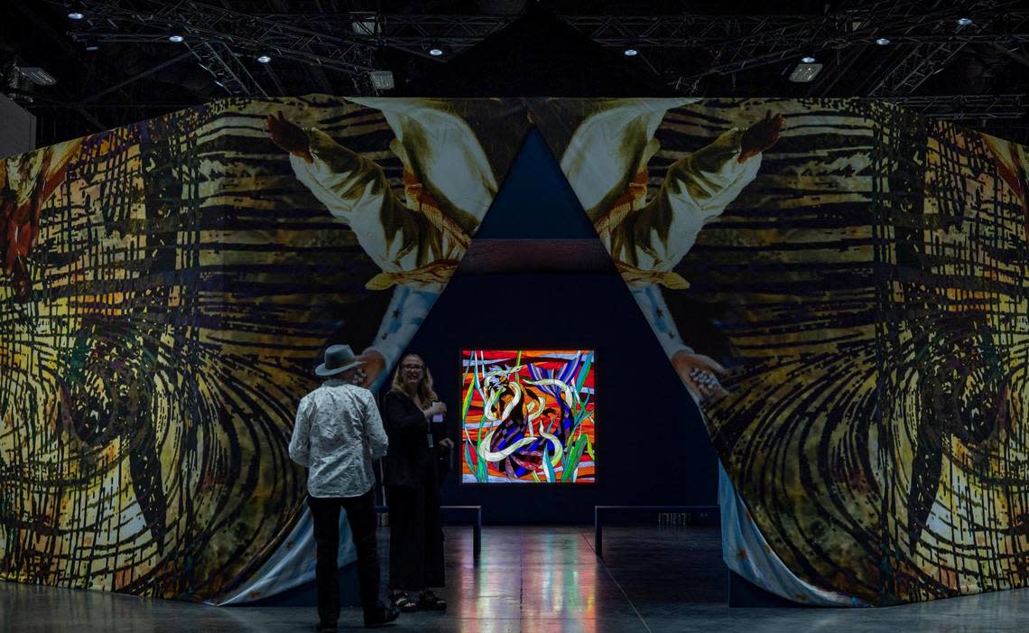 The entrance to Christopher Myers’ “Let the Mermaids Flirt With Me” centers on a piece consisting of stained glass light boxes, at the Meridians sector during Art Basel VIP opening day at the Miami Beach Convention Center.
