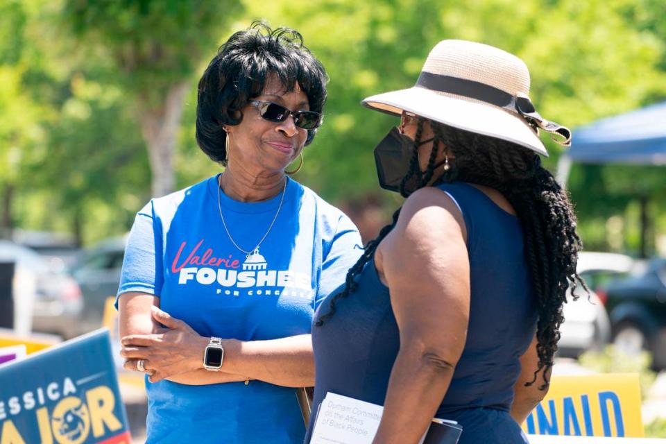 Congressional candidate Valerie Foushee talks with Brenda Ford Harding outside the polling site at South Regional Durham County Library in Durham, N.C. on Tuesday, May 17, 2022. Foushee won the Democratic primary to represent District 4 in Congress.