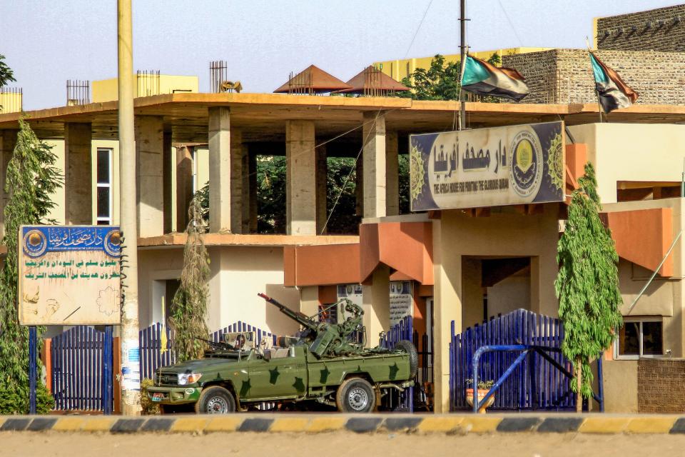 A "technical" vehicle (pickup truck mounted with turret) of Sudan's Rapid Support Forces (RSF) paramilitaries is stationed outside the offices of Dar al-Mushaf (African Holy Koran Publishing House), in the south of Sudan's capital Khartoum on April 17, 2023.