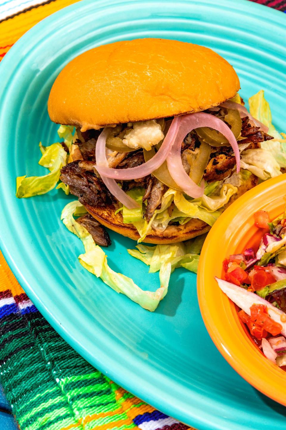 A lunch platter of tortas are on Taco Boy's newly revised menus in Asheville.