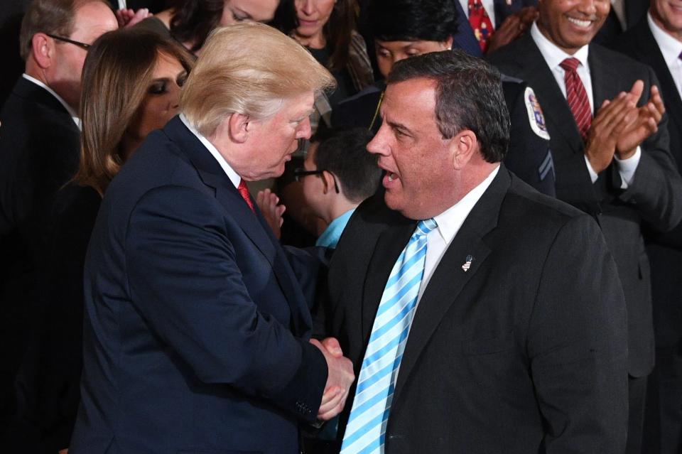 President Donald Trump shakes hands with New Jersey governor Chris Christie after he delivered remarks on combatting drug demand and the opioid crisis on October 26, 2017, in the East Room of the White House in Washington, D.C.