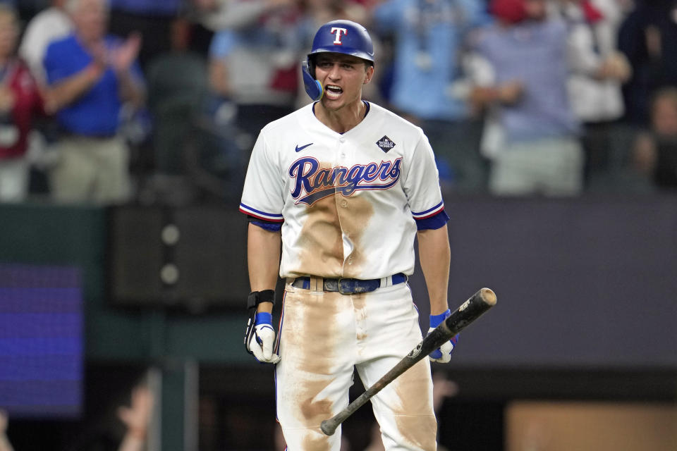 Texas Rangers' Corey Seager celebrates after hitting a two-run home run against the Arizona Diamondbacks during the ninth inning in Game 1 of the baseball World Series Friday, Oct. 27, 2023, in Arlington, Texas. (AP Photo/Godofredo A. Vásquez)