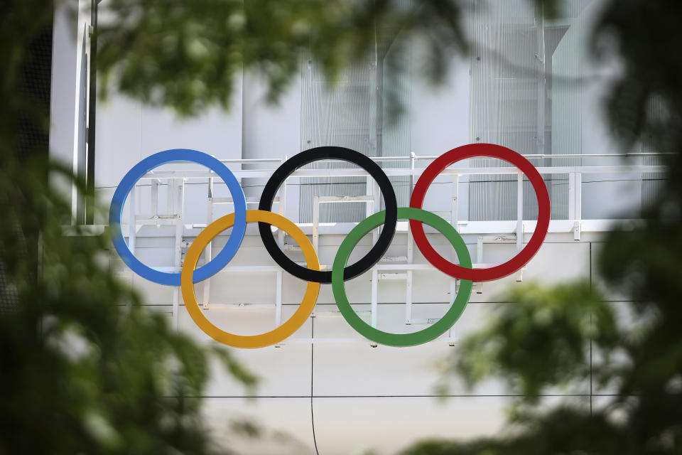 The Olympic rings are seen at the Paris La Defense Arena, Wednesday, June 12, 2024 in Nanterre, outside Paris. The Paris La Defense Arena will host the swimming and some water polo events during the Paris 2024 Olympic Games. (AP Photo/Thomas Padilla)