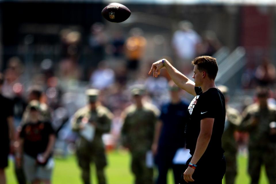 Cincinnati Bengals quarterback Joe Burrow (9) tosses a ball while running through plays during preseason training camp at Paul Brown Stadium Monday, Aug. 8, 2022. Monday was the first practice where he wasn't using the golf cart to get around after an appendectomy two weeks ago.