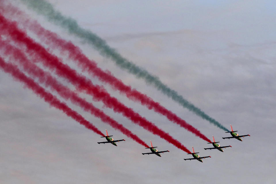 FILE - Belarus army Su-25 jet planes leave a trace in the colors of the national as they fly over the city as they prepare for a military air show ahead of the Independence Day military parade, Minsk, Belarus, Monday, July 1, 2019. Russian President Vladimir Putin has said that Russia has upgraded 10 Belarusian aircraft to allow them to carry nuclear weapons and their crews will start training next month as part of a plan to deploy Russian tactical nuclear weapons to Belarus. (AP Photo/Sergei Grits)