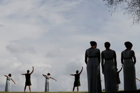 Olympics - Dress Rehearsal - Lighting Ceremony of the Olympic Flame Pyeongchang 2018 - Ancient Olympia, Olympia, Greece - October 23, 2017 Actors perform during the dress rehearsal for the Olympic flame lighting ceremony for the Pyeongchang 2018 Winter Olympic Games at the site of ancient Olympia in Greece REUTERS/Alkis Konstantinidis