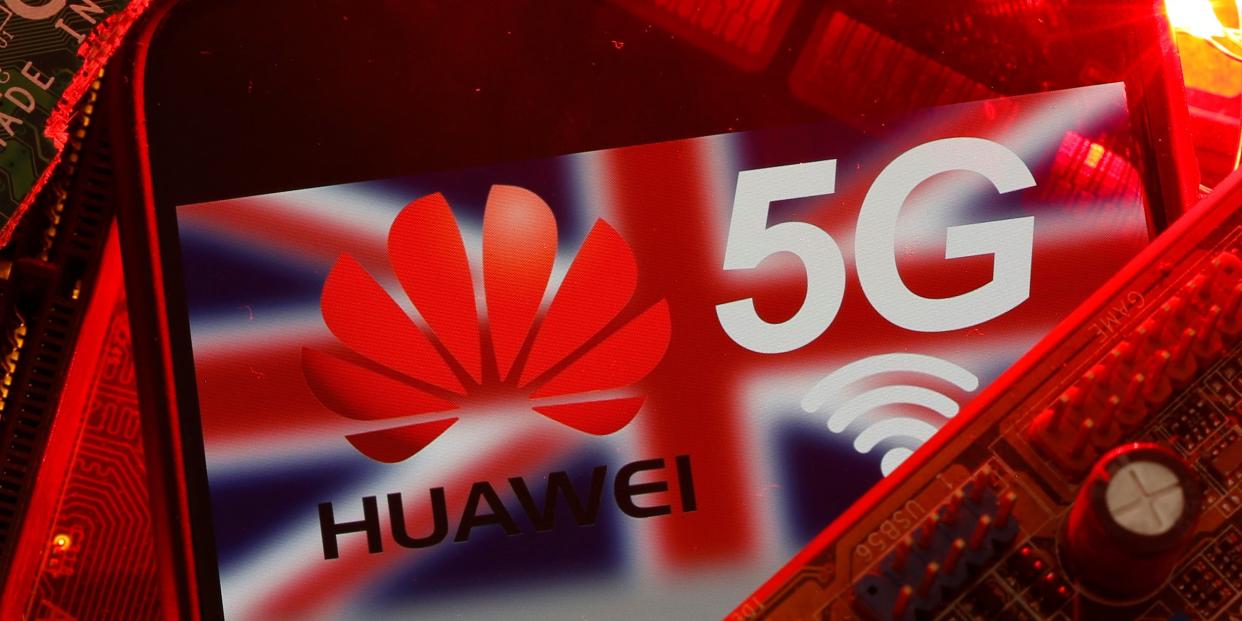 FILE PHOTO: The British flag and a smartphone with a Huawei and 5G network logo are seen on a PC motherboard in this illustration picture taken January 29, 2020. REUTERS/Dado Ruvic/Illustration