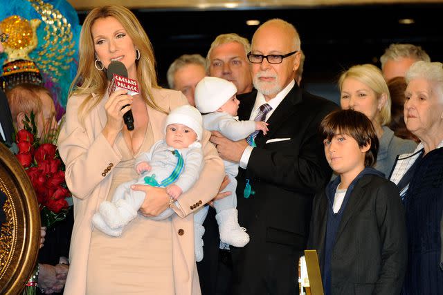 <p>Ethan Miller/Getty</p> Celine Dion with her newborn twin sons in 2011