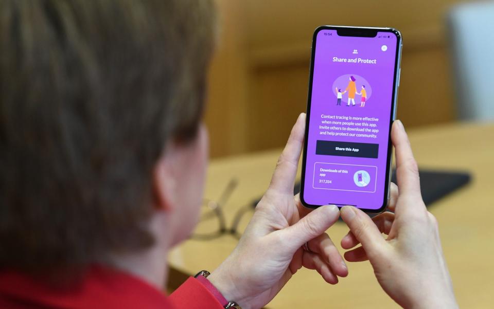 First Minister Nicola Sturgeon views the new Covid - 19 track and trace app - Jeff J Mitchell/Getty