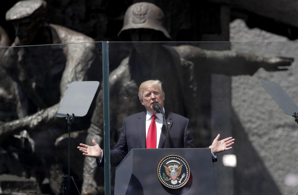 FILE - In this file photo dated Thursday, July 6, 2017, U.S. President Donald Trump delivers a speech before the Warsaw Uprising Monument in Warsaw, Poland. Dozens of former Polish ambassadors are telling Trump that Poland's democracy is at risk, in an open letter published Tuesday Aug. 27, 2019, ahead of the U.S. President's visit to attend ceremonies upcoming Saturday in Warsaw marking the 80th anniversary of the start of World War II. (AP Photo/Petr David Josek, FILE)