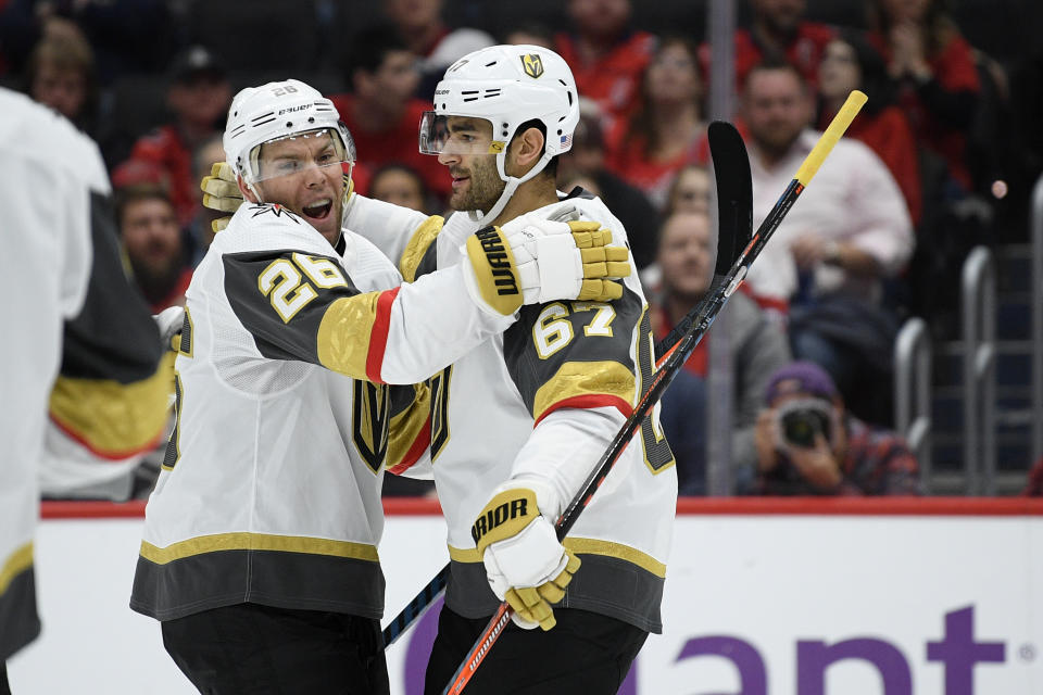 Vegas Golden Knights left wing Max Pacioretty (67) celebrates his goal with center Paul Stastny (26) during the first period of an NHL hockey game against the Washington Capitals, Saturday, Nov. 9, 2019, in Washington. (AP Photo/Nick Wass)