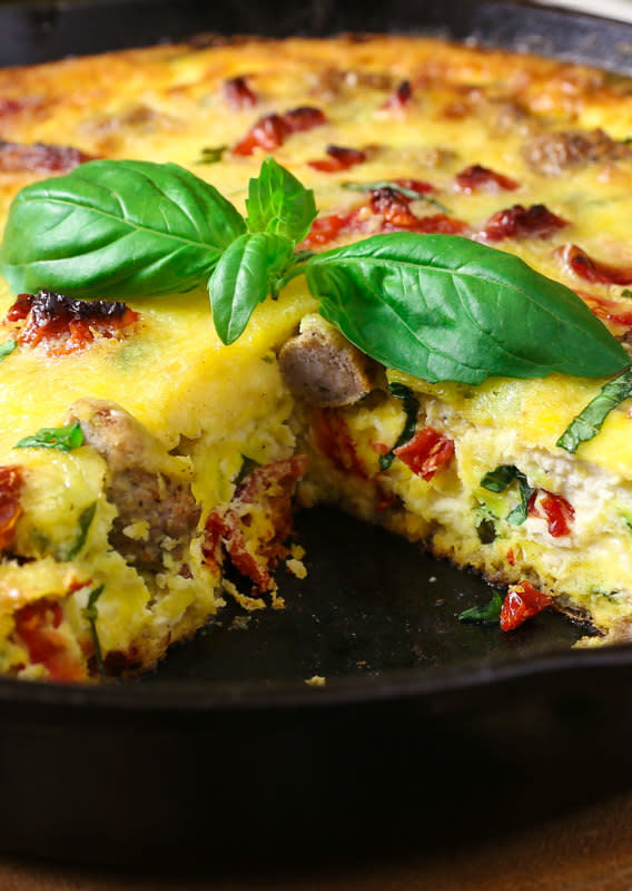 The Slow Roasted Italian<p>Cooked in a cast iron skillet, this frittata is light and fluffy with pockets of melty cheese throughout. Bejeweled with sweet sun-dried tomatoes, basil and flavorful sausage, this is my all-time favorite brunch!</p><p><strong>Get the recipe: </strong><strong><a href="https://www.theslowroasteditalian.com/2016/02/sun-dried-tomato-ricotta-frittata-recipe.html" rel="sponsored" target="_blank" data-ylk="slk:Sundried Tomato and Ricotta Frittata;elm:context_link;itc:0;sec:content-canvas" class="link ">Sundried Tomato and Ricotta Frittata</a></strong></p><p><strong>Related: <a href="https://www.yahoo.com/lifestyle/25-scrumptious-versions-eggs-benedict-222900316.html" data-ylk="slk:25 Versions of Eggs Benedict;elm:context_link;itc:0;sec:content-canvas;outcm:mb_qualified_link;_E:mb_qualified_link;ct:story;" class="link  yahoo-link">25 Versions of Eggs Benedict</a></strong></p>