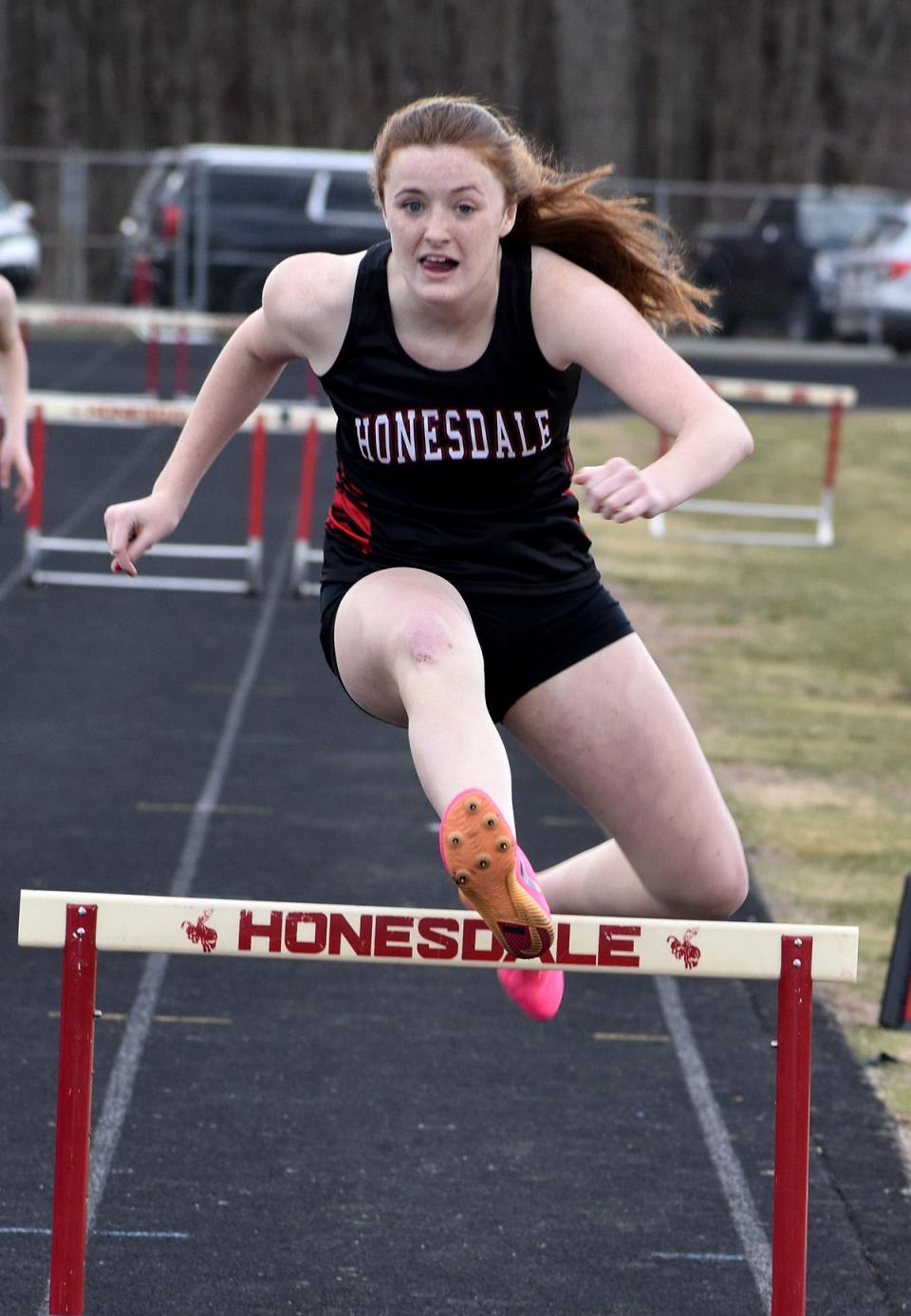Honesdale's Ruby Martin sails over the final hurdle on her way to victory in the 300M event against Western Wayne.