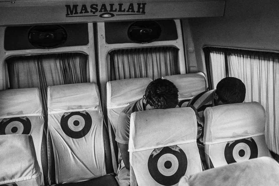 Exhausted refugees who failed to cross the sea from the Turkish coast to the Greek island of Kos head back to Bodrum city centre by bus before trying to cross again later in July 2015 (Emin Ozmen/Magnum Photos)