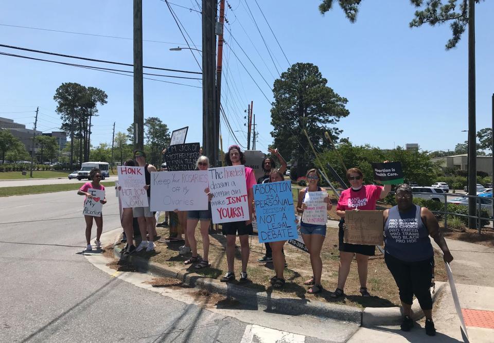 Activists protest the Supreme Court's potential overturning of Roe V. Wade, which protects a woman's right to have an abortion, on 17th Street in Wilmington. They hope to convince local leaders to enact laws and/or policies that would protect and/or support women in New Hanover County who choose to have an abortion.