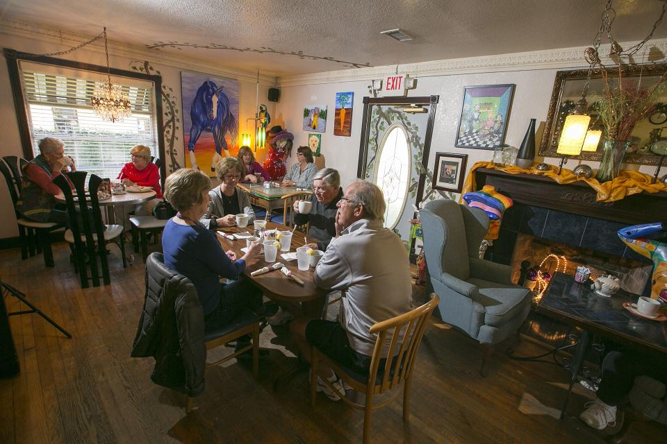 Patrons enjoy lunch in the cozy eclectic decor at B.D. Beans in Belleview, Florida on Friday, January 16, 2015.