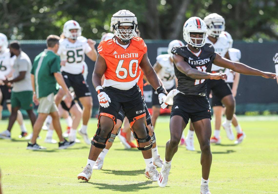 Miami Hurricanes offensive lineman Zion Nelson (60) warms up during practice drills at the University of Miami’s Greentree Practice Field in Coral Gables on Wednesday, March 9, 2022.