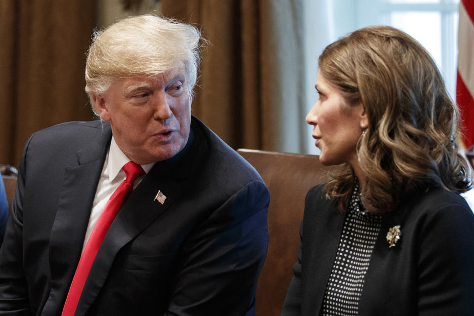 FILE - President Donald Trump speaks to Gov.-elect Kristi Noem, R-S.D., during a meeting at the White House, Dec. 12, 2018, in Washington. South Dakota Gov. Noem's election-year fight with fellow Republicans in the Legislature has spurred criticism she is neglecting her job to angle for the White House. (AP Photo/Evan Vucci, File)