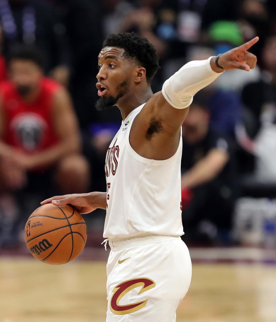 Cleveland Cavaliers guard Donovan Mitchell (45) gives directions during the second quarter of an NBA basketball game against the Washington Wizards at Rocket Mortgage FieldHouse, Sunday, Oct. 23, 2022, in Cleveland, Ohio.