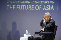 Malaysia's former Prime Minister Mahathir Mohamad adjusts an earphone before answering questions at a session of the International Conference on "The Future of Asia" Friday, May 27, 2022 in Tokyo. (AP Photo/Eugene Hoshiko)