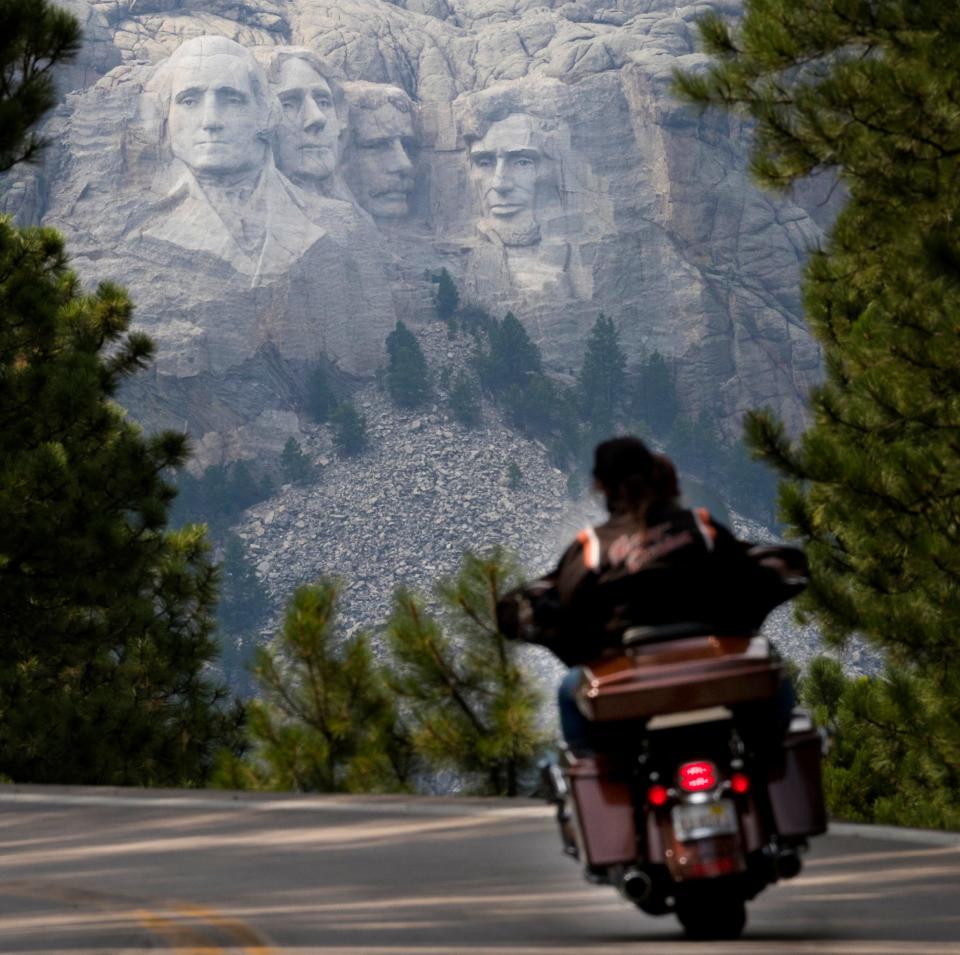 A Harley-Davidson exits a tunnel near Mount Rushmore last August during the 78th Sturgis Motorcycle Rally.