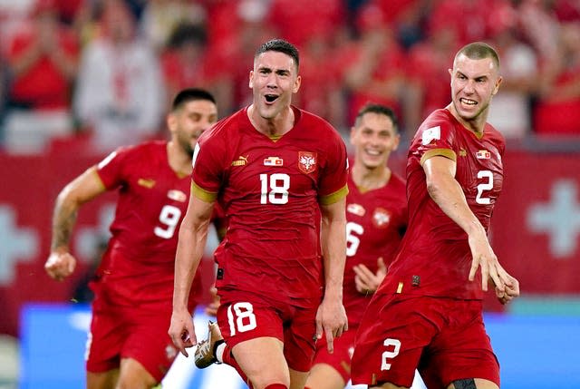 Serbia's Dusan Vlahovic (centre) celebrates