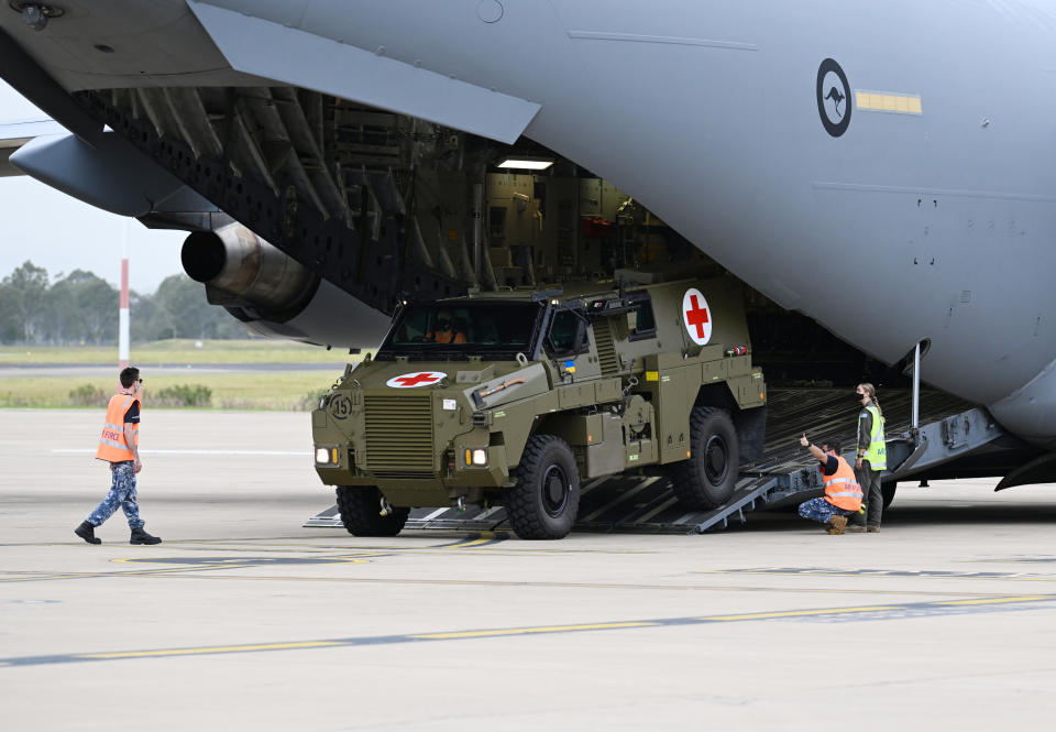 IPSWICH, AUSTRALIA - APRIL 08: An Australian Bushmaster PMV Armoured Vehicle is loaded onto a RAAF C-17 cargo plane at the Amberley Air Base on April 08, 2022 in Ipswich, Australia. The Australian government is sending a total of 20 Bushmaster Protected Mobility Vehicles to Ukraine following a direct request for assistance by Ukrainian President Volodymyr Zelenskyy during his virtual address to the Australian parliament last Thursday. (Photo by Dan Peled/Getty Images)