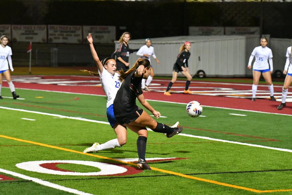 Oaks Christian's Sarah Spears fires a shot to score a goal against visiting Westlake in their Marmonte League showdown on Tuesday night. The Lions won 3-0 to take sole possession of first place.