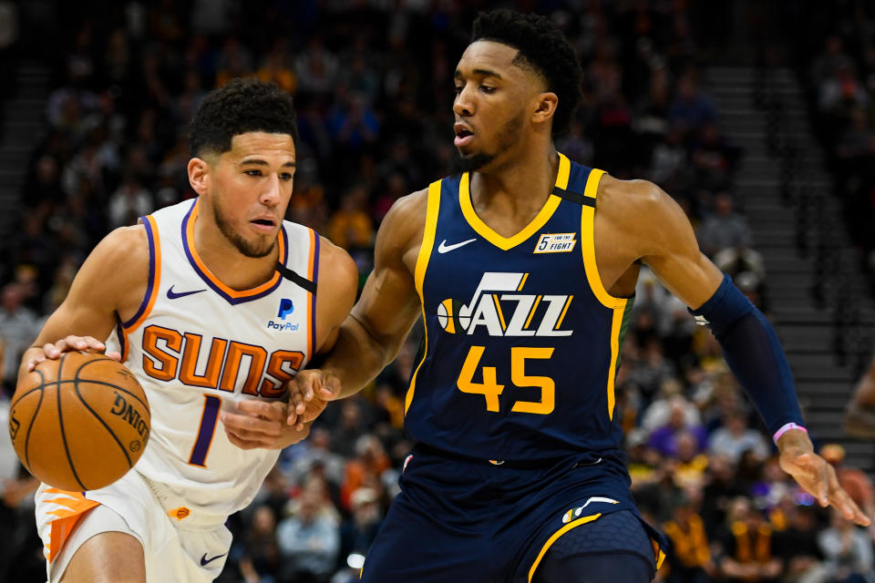 Suns guard Devin Booker and Jazz counterpart Donovan Mitchell are two of the NBA's brightest rising stars. (Alex Goodlett/Getty Images)